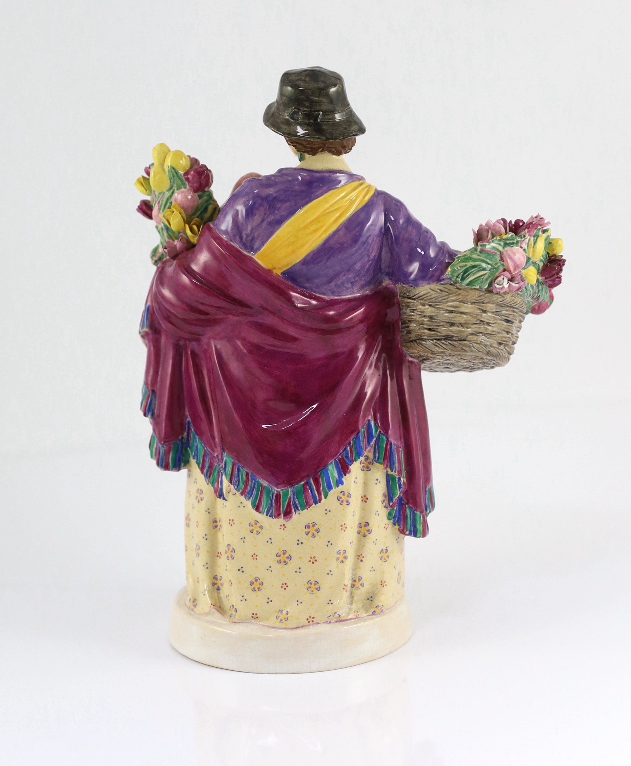 Charles Vyse (1882-1971) - a Chelsea Pottery figure, 'The Tulip Woman', the circular underside inscribed with monograms CV, Chelsea and dated 1924, 26cm high